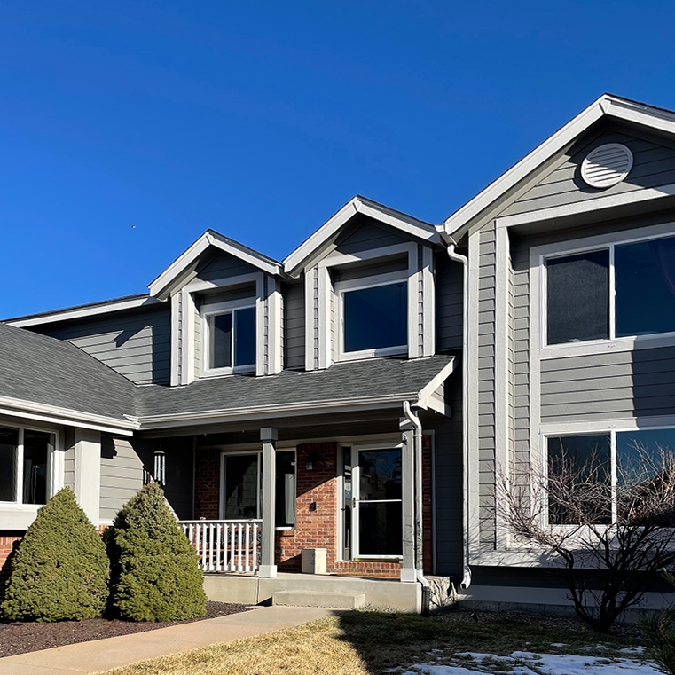 After image of white picture windows post hailstorm in Colorado Springs. 