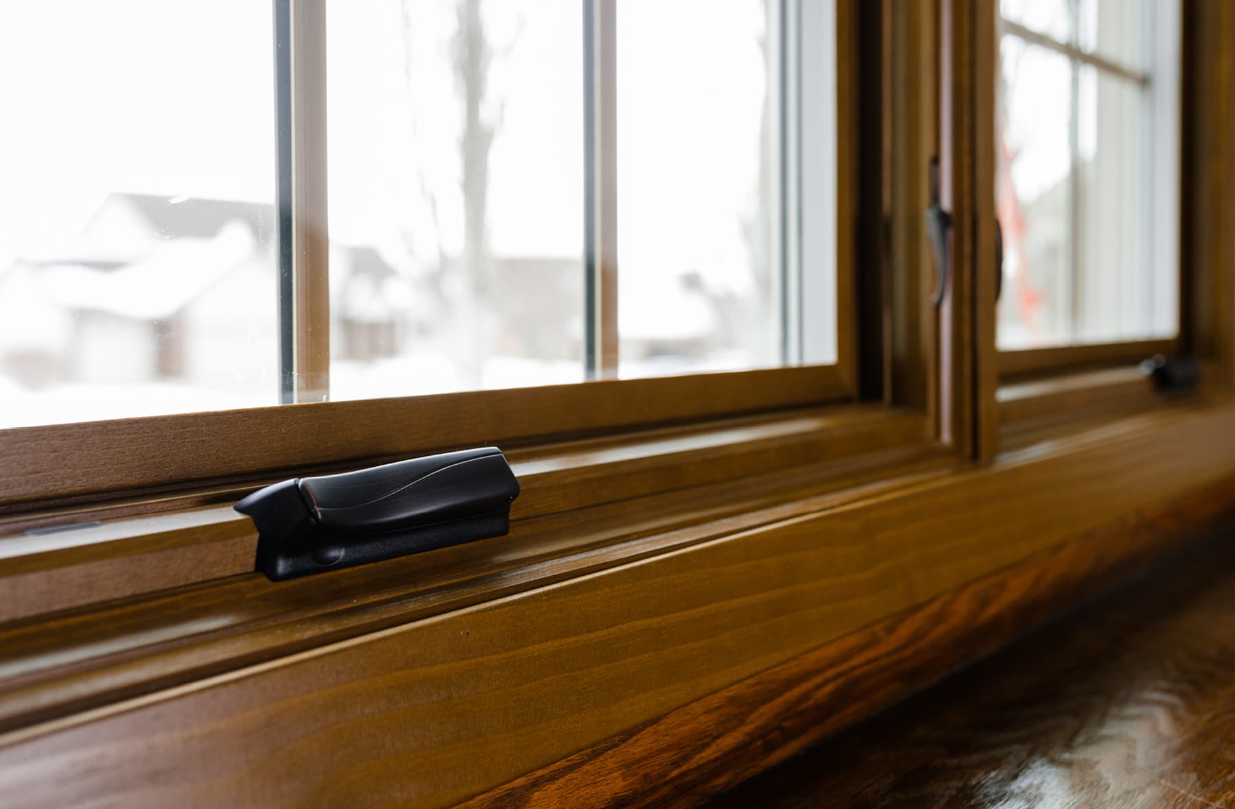 wood window sill with oil-rubbed bronze hardware