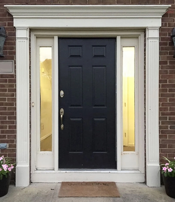 Outdated front door of Grove City home.