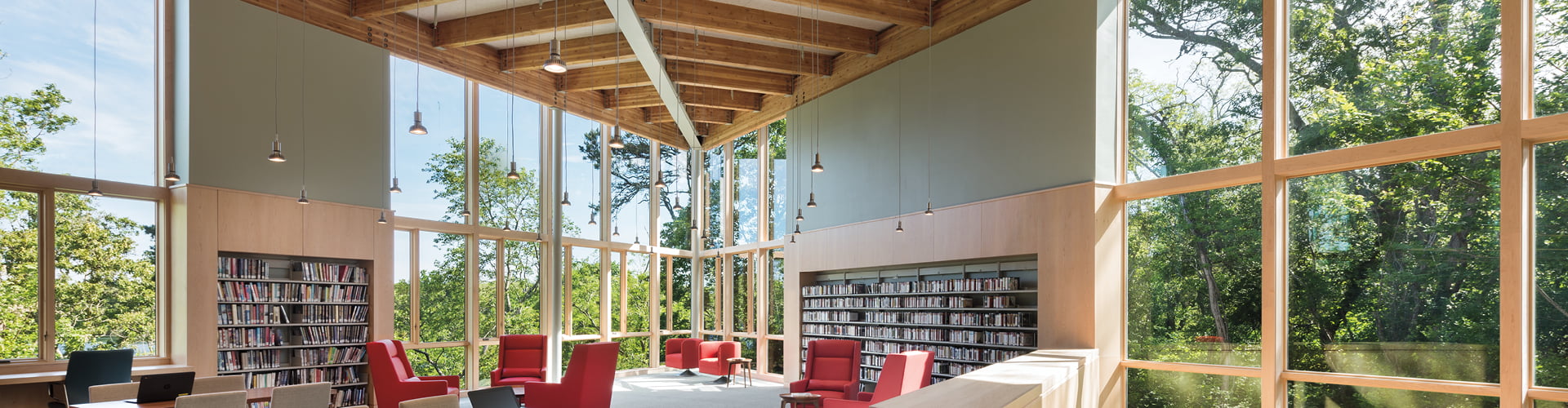 Eastham public library with red chairs and window walls