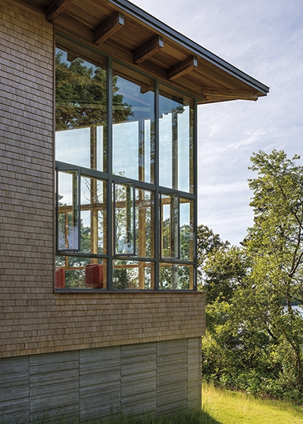 Sideview of Eastham library addition with wall of Pella glass windows.