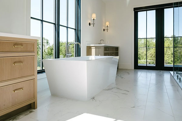 Interior shot of Charlottesville modern farmhouse bathroom with newly installed black floor-to-ceiling windows.