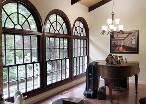 chris loves julia three wood double-hung windows with arched transoms match painting on the wall