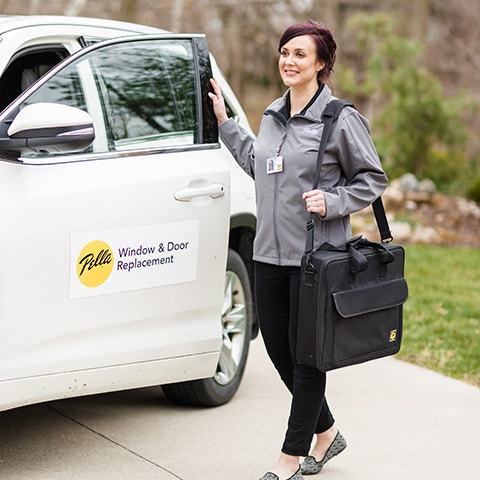 pella employee holding a patent he earned for pella