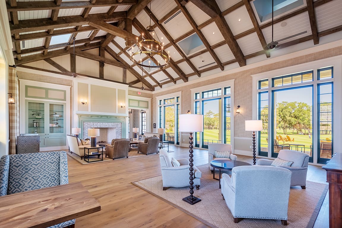 Interior of Cougar Point Gulf Club highlighting oversized windows.