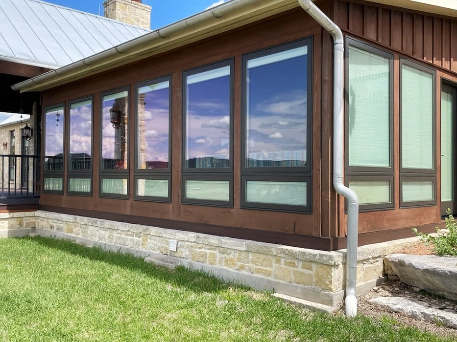 Newly built sunroom for Bandera home with Pella windows with built-in shades.