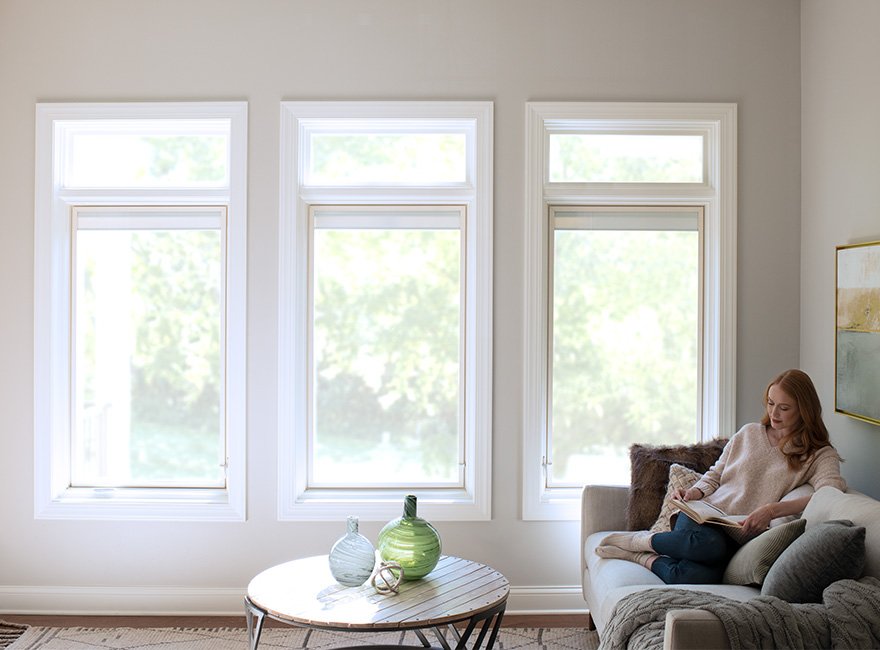 woman sitting by energy efficient lifestyle series windows