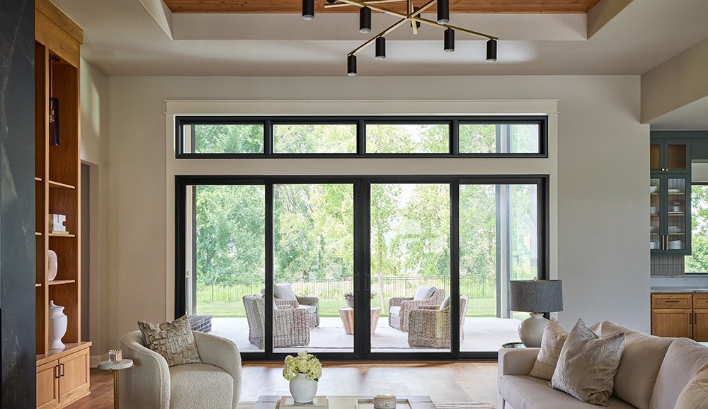 Black-framed sliding patio door in a modern living room.