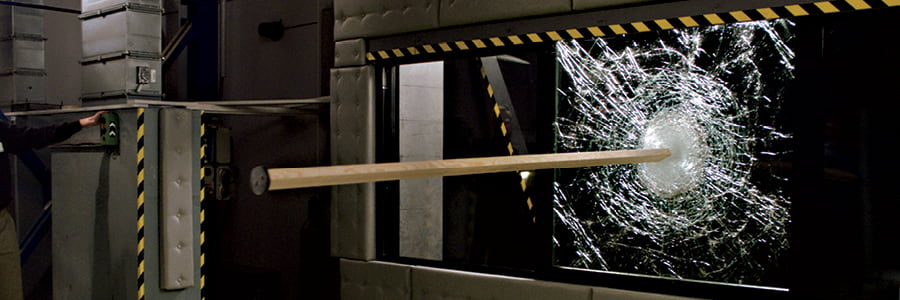 An impact testing example with wood stuck in a Hurricane Shield window