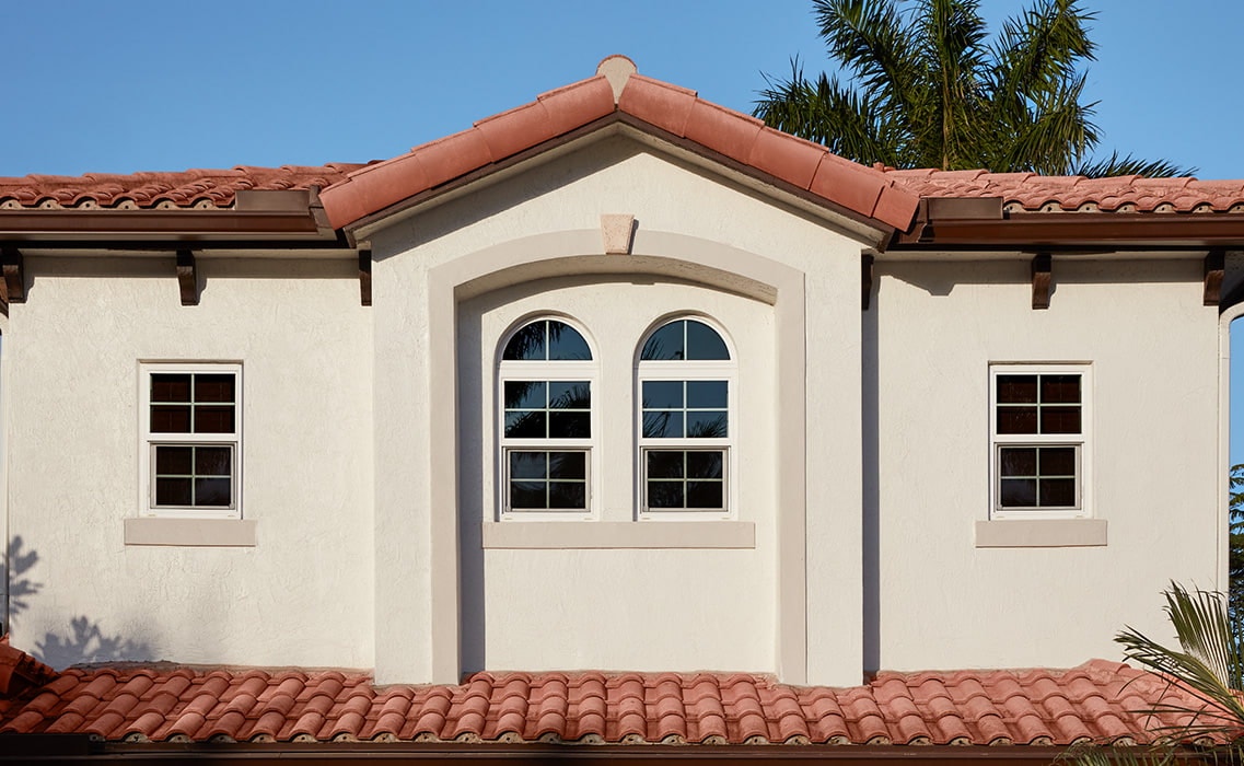 a southern home with stucco exterior finishes and double-hung windows