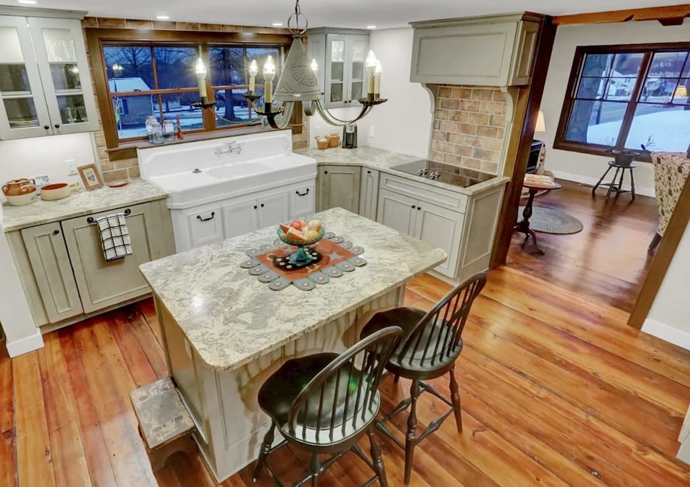 Interior image of Carlisle farm cabin kitchen highlighting newly installed Pella windows.