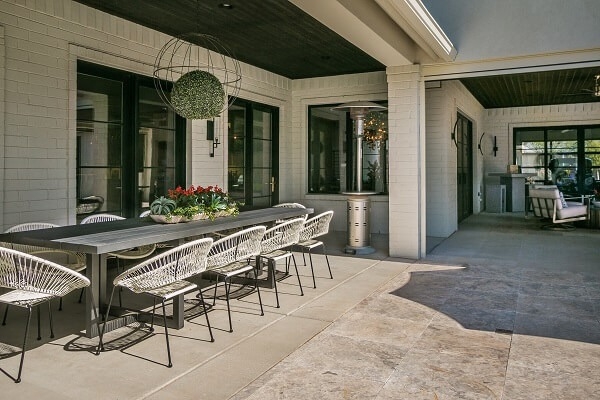 Outside entertaining area of Amarillo home sporting newly installed black casement Pella windows.