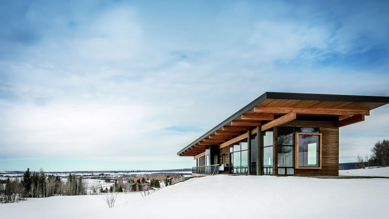 luxury contemporary home on a snow-covered mountain