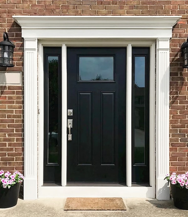 Newly installed fiberglass black door replacement on Grove City home.