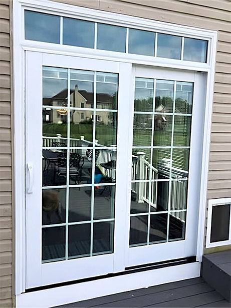 After image of a patio door with retractable screen and white grilles