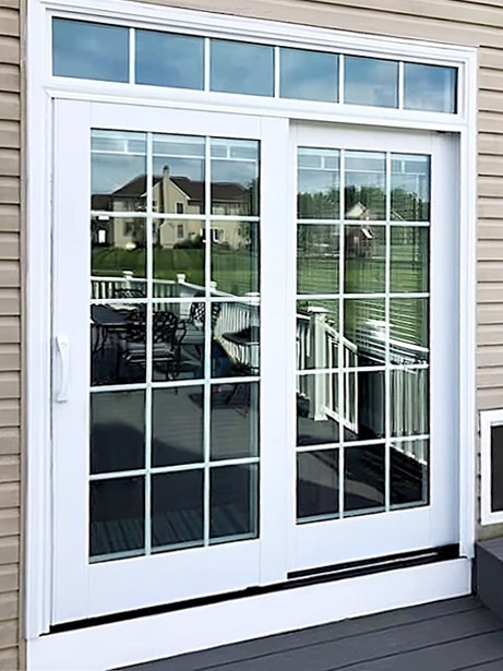 Image of an sliding patio door with retractable screen for a Whitehall home.