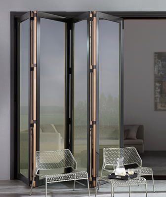 four panels of a bifold patio door open to the left of the opening as seen from the exterior