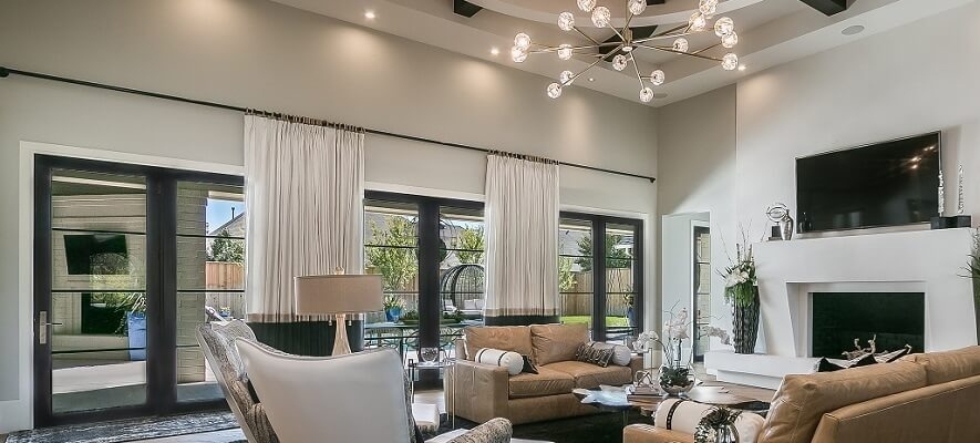 Living room in modern farmhouse in Amarillo with casement windows.