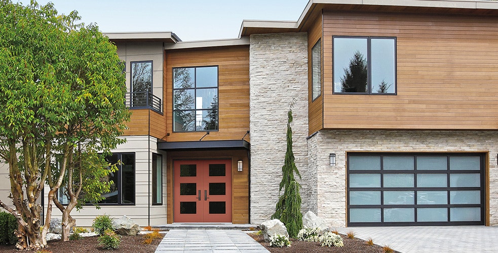 contemporary home with exterior trim on a fiberglass entry door