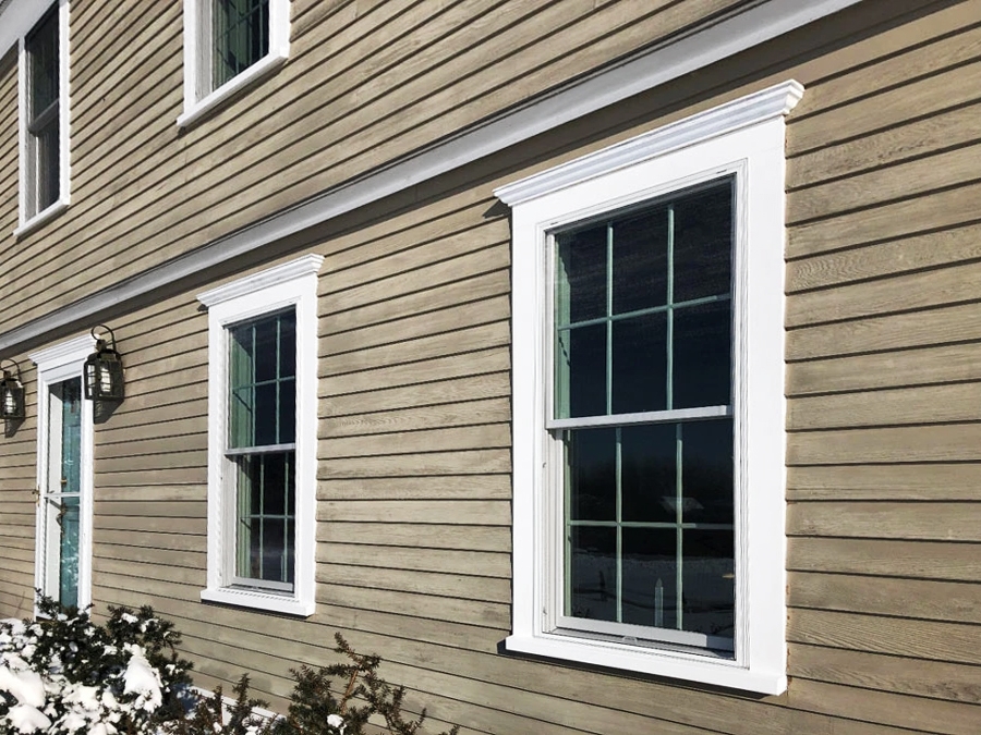 Closeup view of Vermont home with newly installed double-hung window.