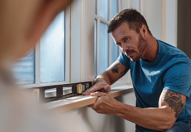 Man making home improvements.