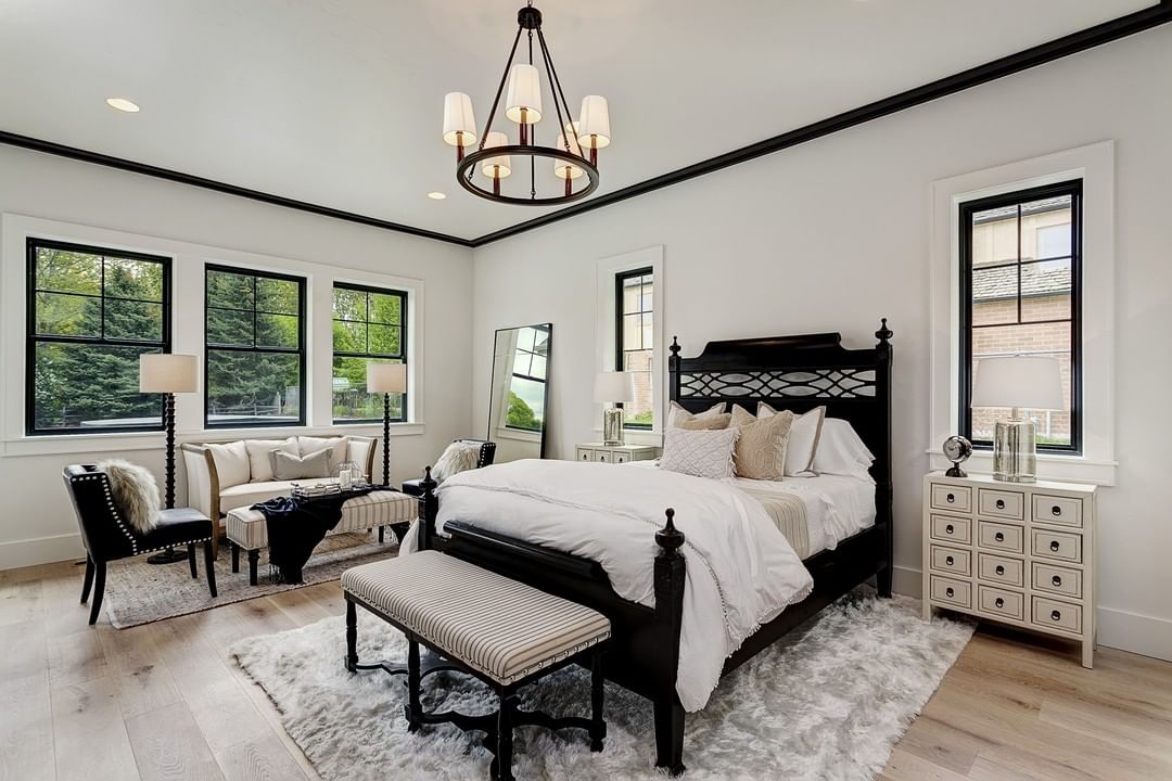 black and white bedroom with black frame windows