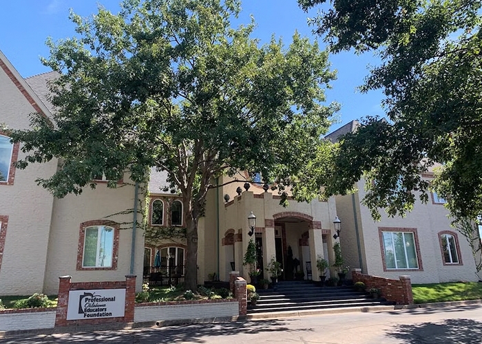 Curbside view of the Norman Education building with newly installed windows.