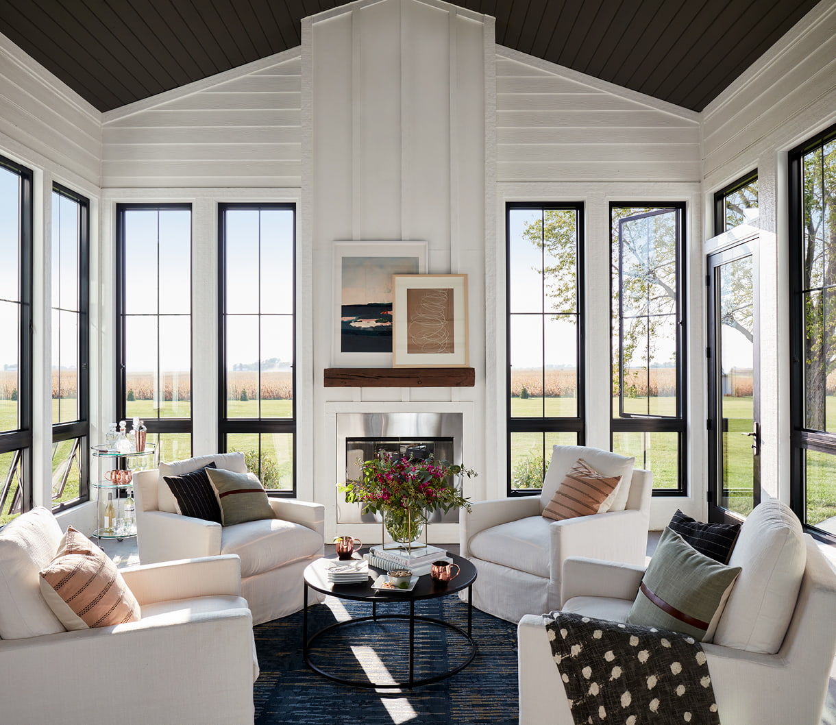 contemporary living room with black casement windows