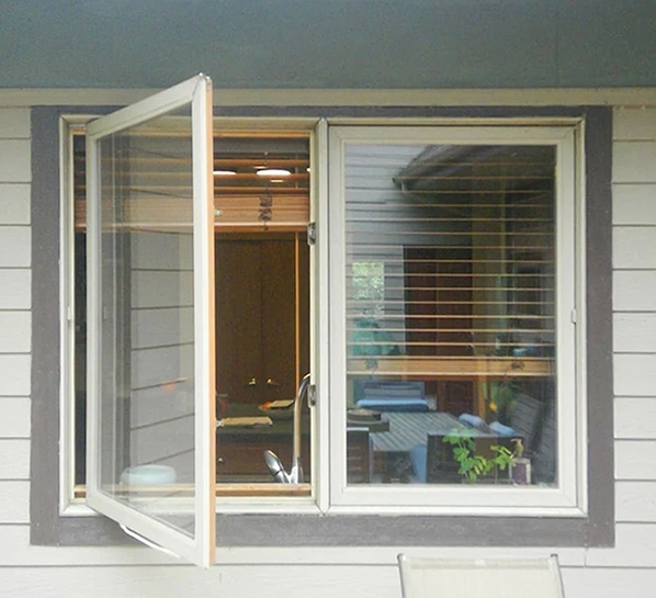 Before image of an exterior casement window above a kitchen sink. 