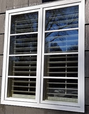 two new white casement windows with blinds-between-the-glass