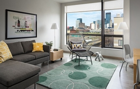 Living room of a unit in The Rose multifamily housing development.