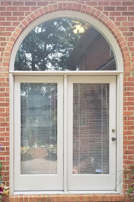 Close up of outdated patio French Door on Henrico home. 