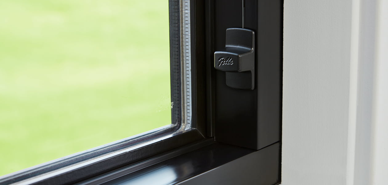 a close-up view of an easy slide operator on a casement impervia window