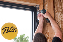 A construction worker is installing a new window using the Steady Set installation system.