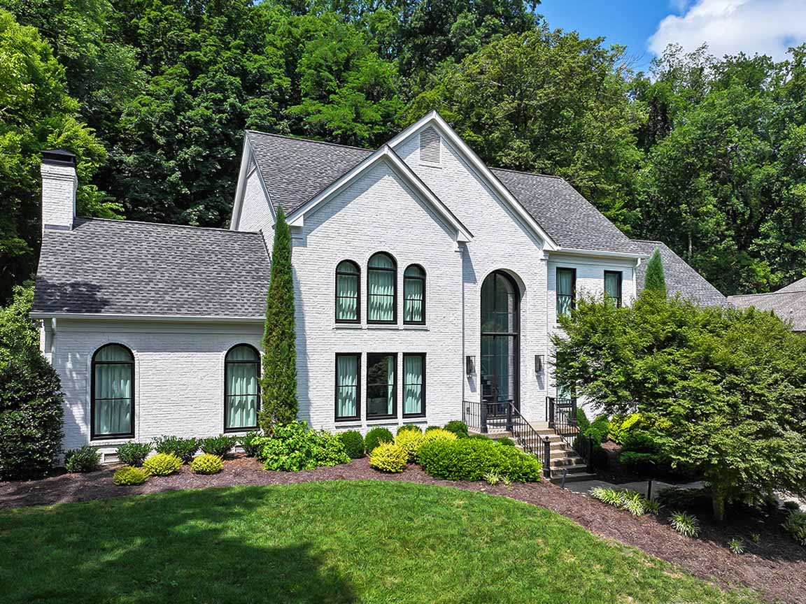 Brentwood home after being refreshed with black windows. 