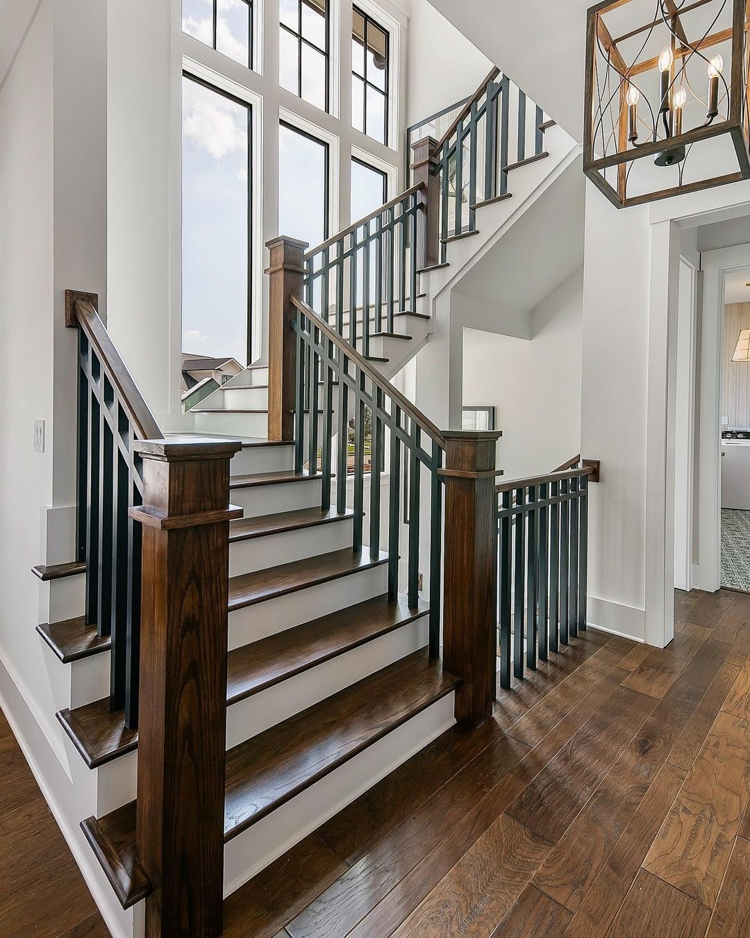 These stairs with windows match black frames with black spindles.