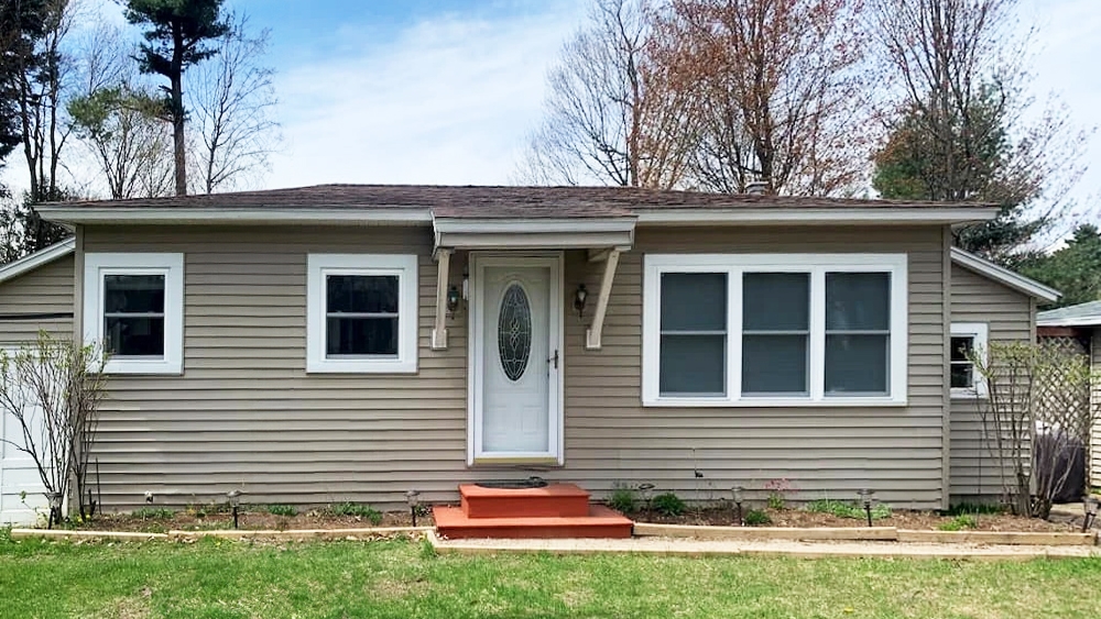 Curbside view of Vermont home with newly replaced vinyl windows.