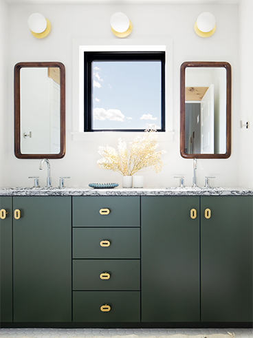 Bathroom vanity with two small mirrors above dual sinks and a square awning window between