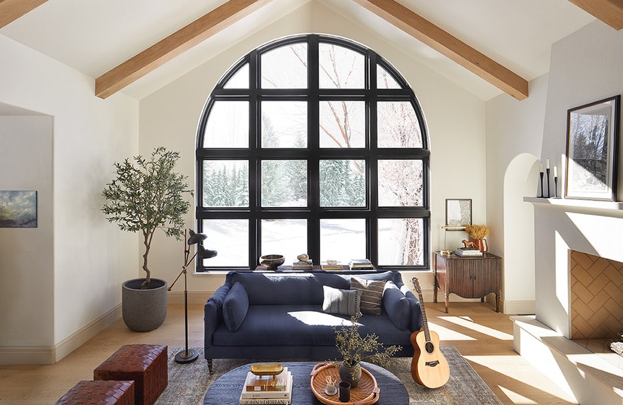 black custom-arched windows floor-to-ceiling
