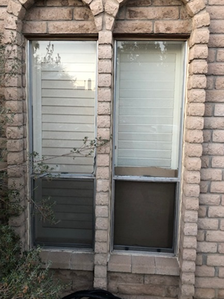 two old, outdated windows on a Phoenix-area home