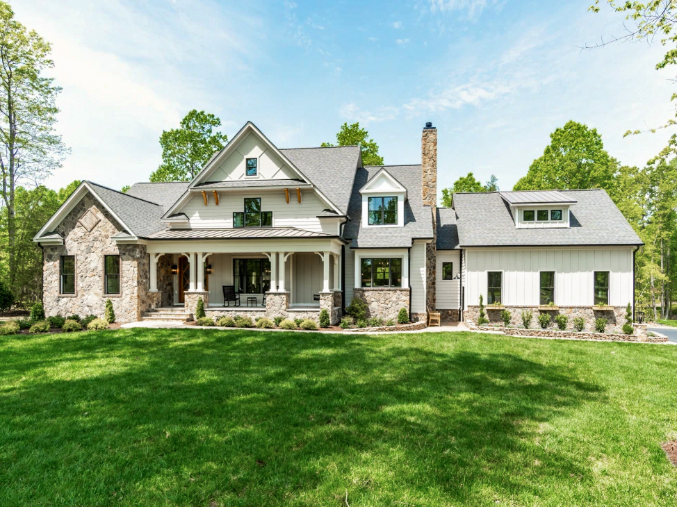 Exterior of newly Richmond farmhouse with Pella black windows.