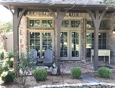 Two sets of french doors on a brick and stone Tulsa home patio