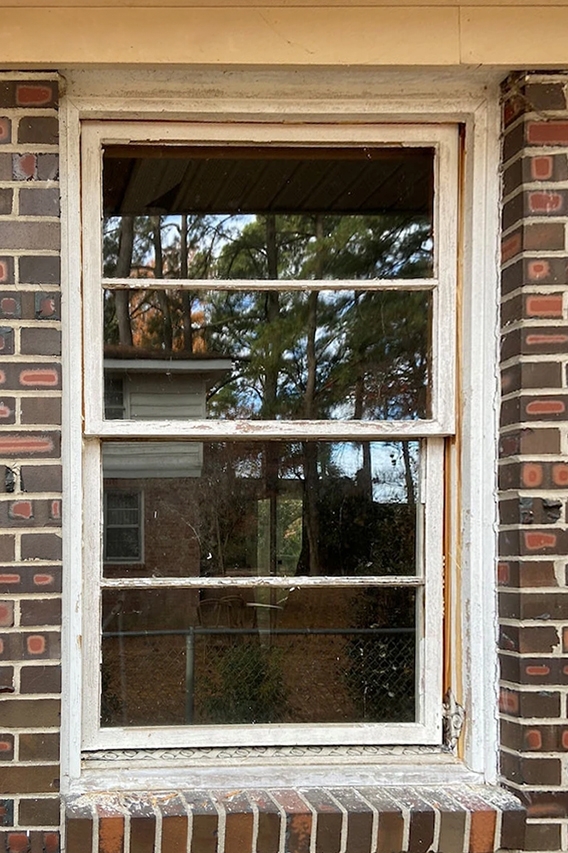 Old window before replacement wood window. 