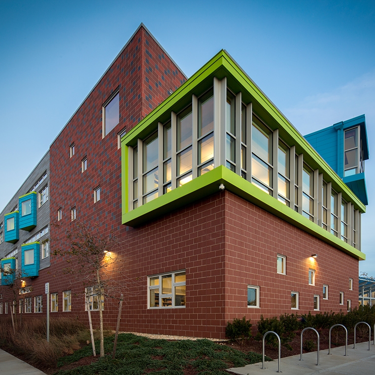 Window wall on side of school, overlooking bike rack