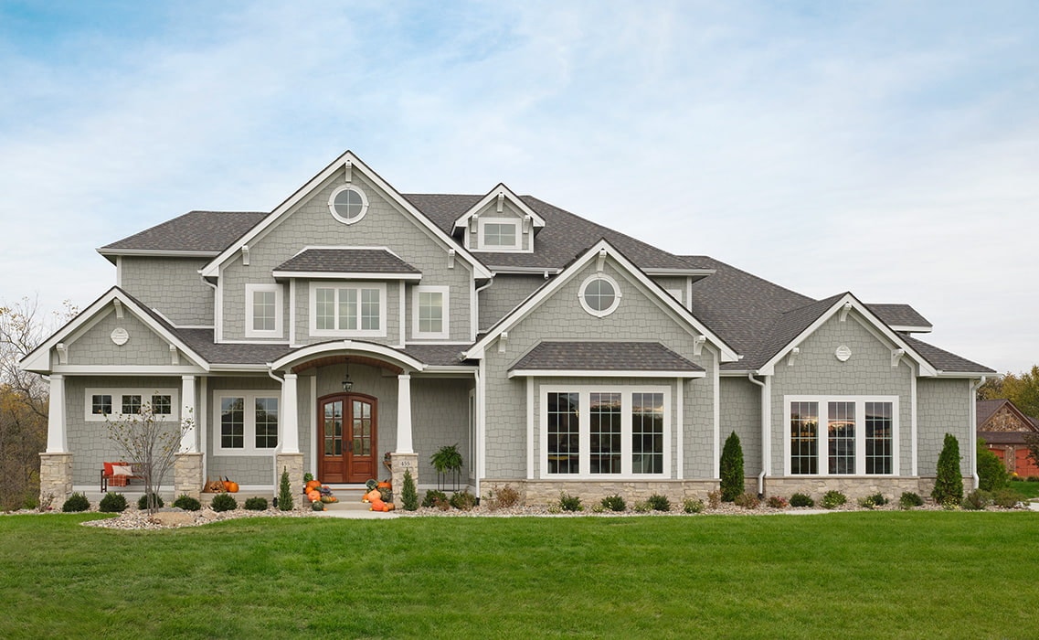 new construction home in the midwest with classic windows and entry door