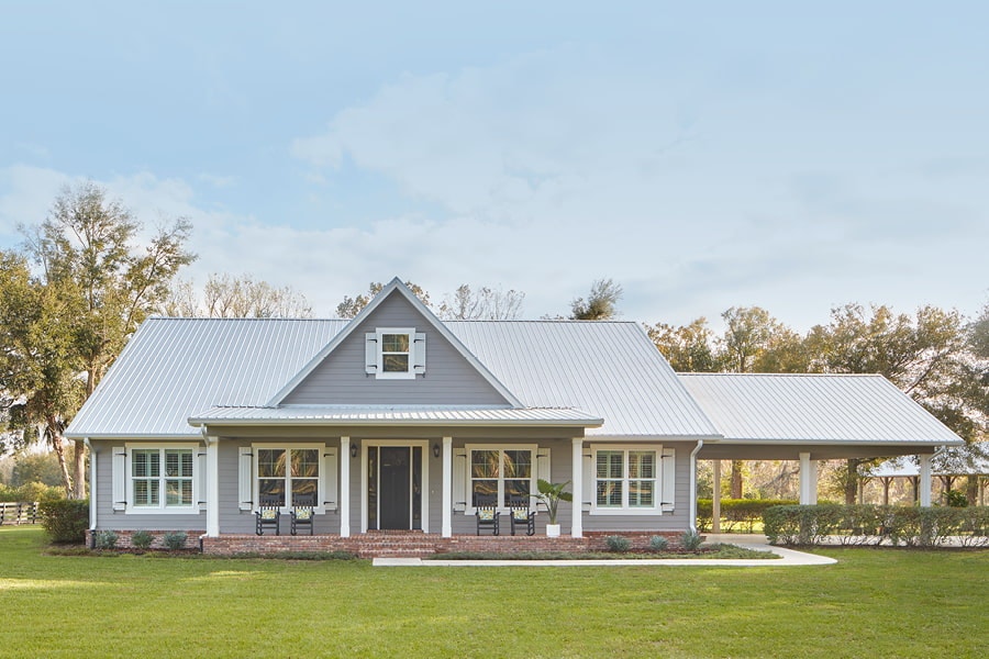 Gray home with white windows and white shutters