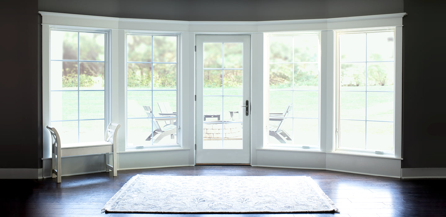 expansive white hinged patio doors with the hinged door in the middle