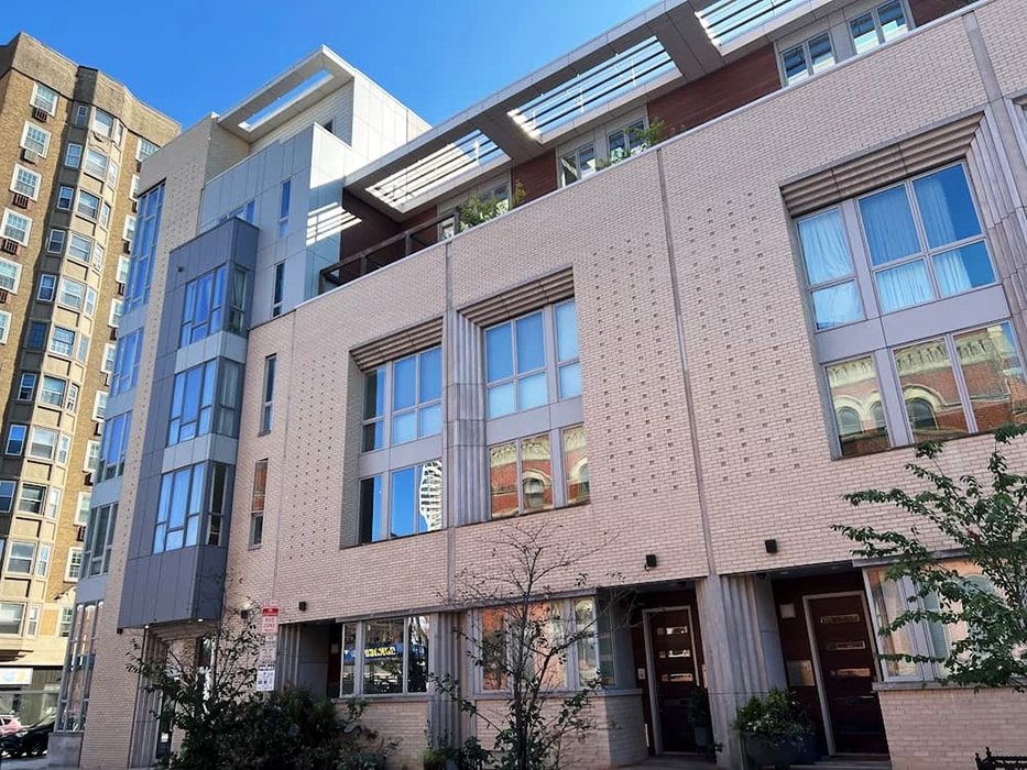 Walnut Estates in Philadelphia with newly installed Pella wood windows offering durability and noise reduction.