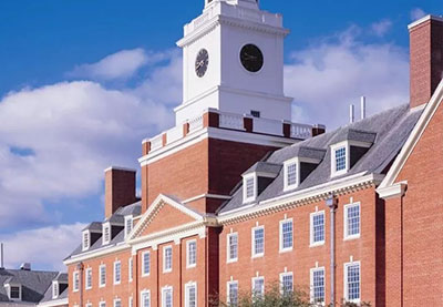 old brick church with white steeple and clock