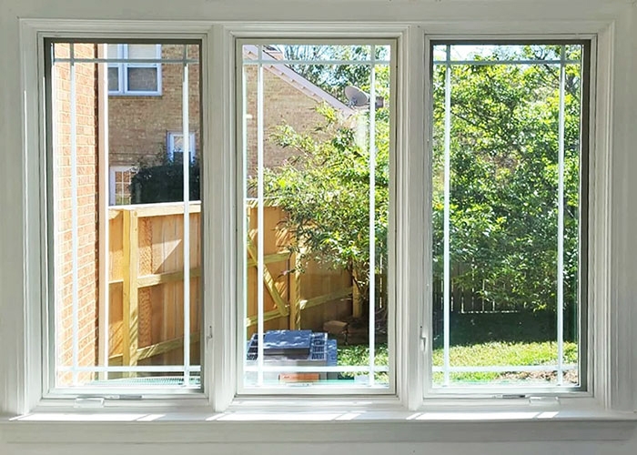 Interior image of wooden windows installed for Virginia Beach home.